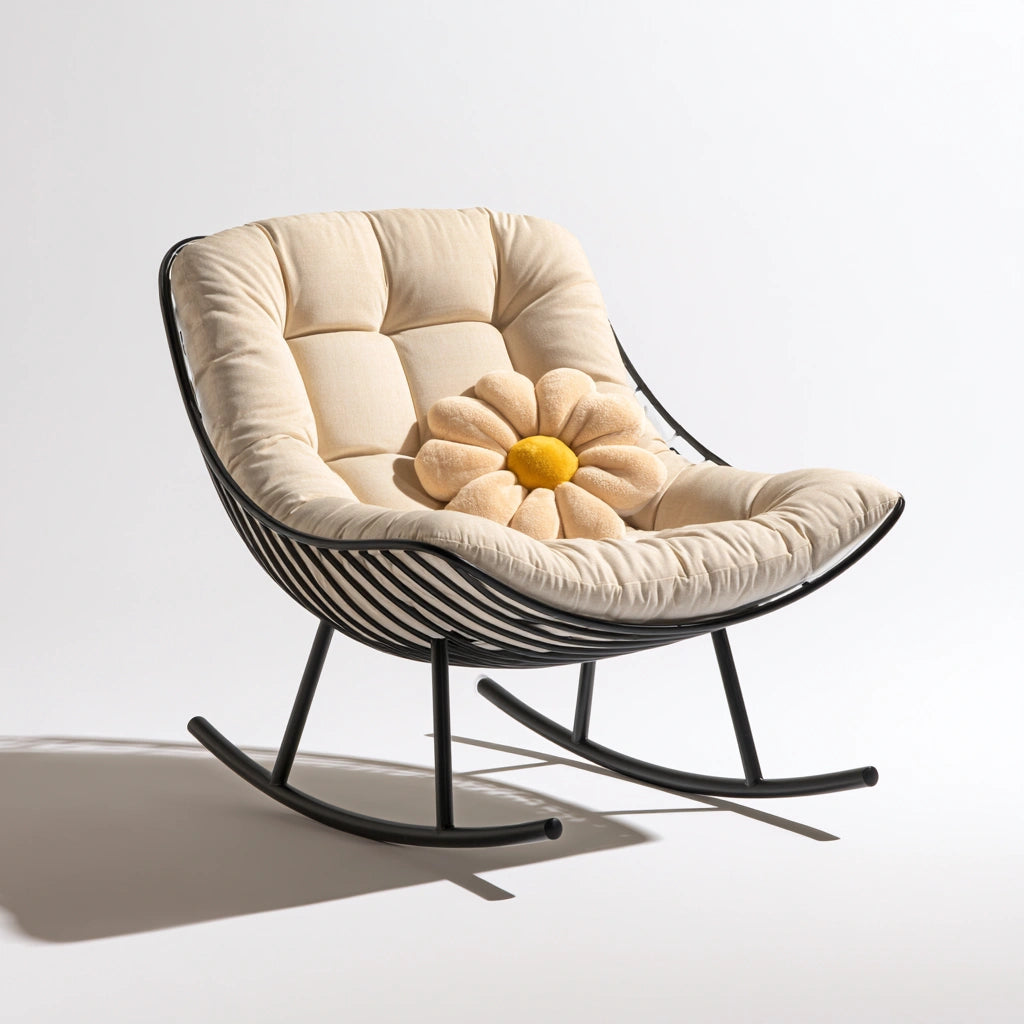 Modern black metal rocking chair with a curved frame, designed for relaxation and comfort in a stylish lounge setting.